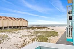 Beachfront Condo with Pool & Porch Swing - Image 4